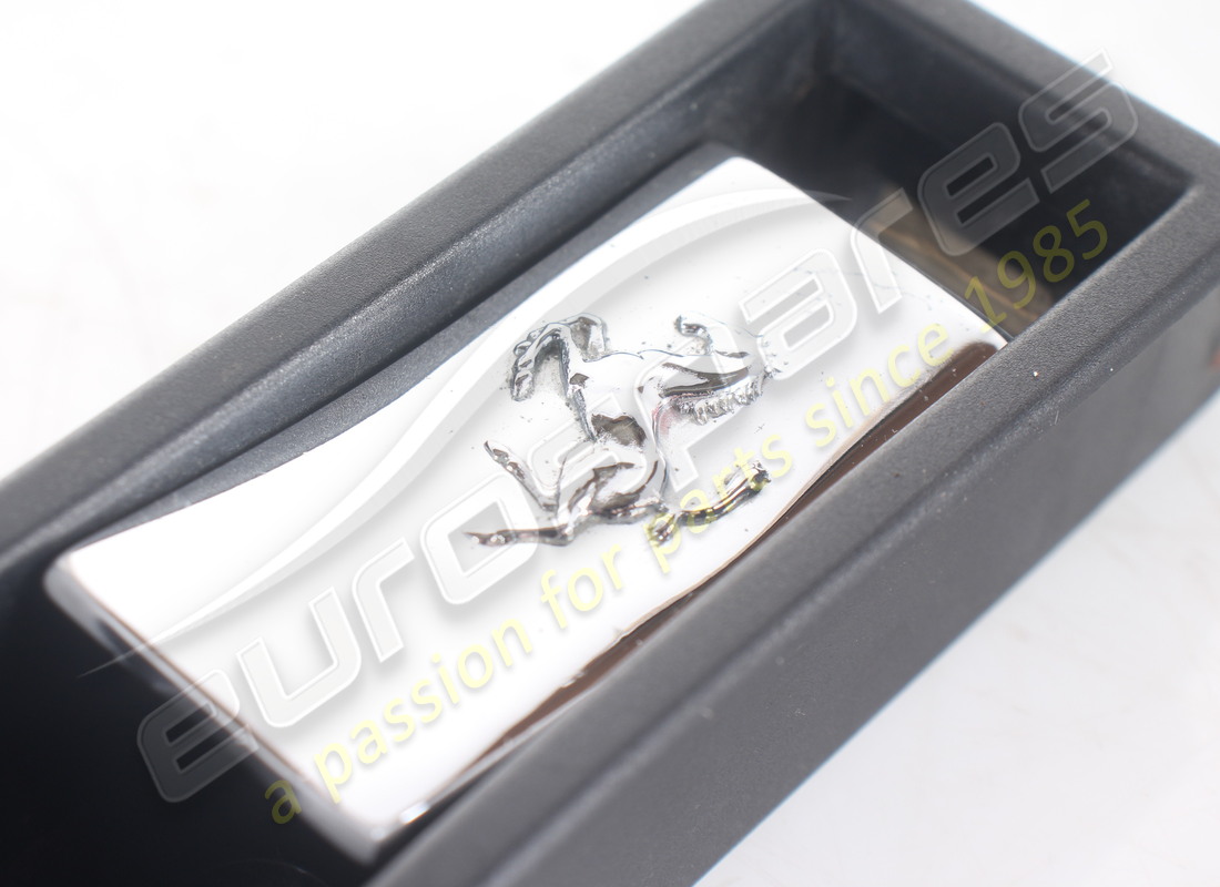 DAMAGED FERRARI INTERNAL BOOT RELEASE HANDLE (EMBOSSED HORSE MOTIF). PART NUMBER 63011800 (7) damaged ferrari internal boot release handle (embossed horse motif). part number 63011800 (7)