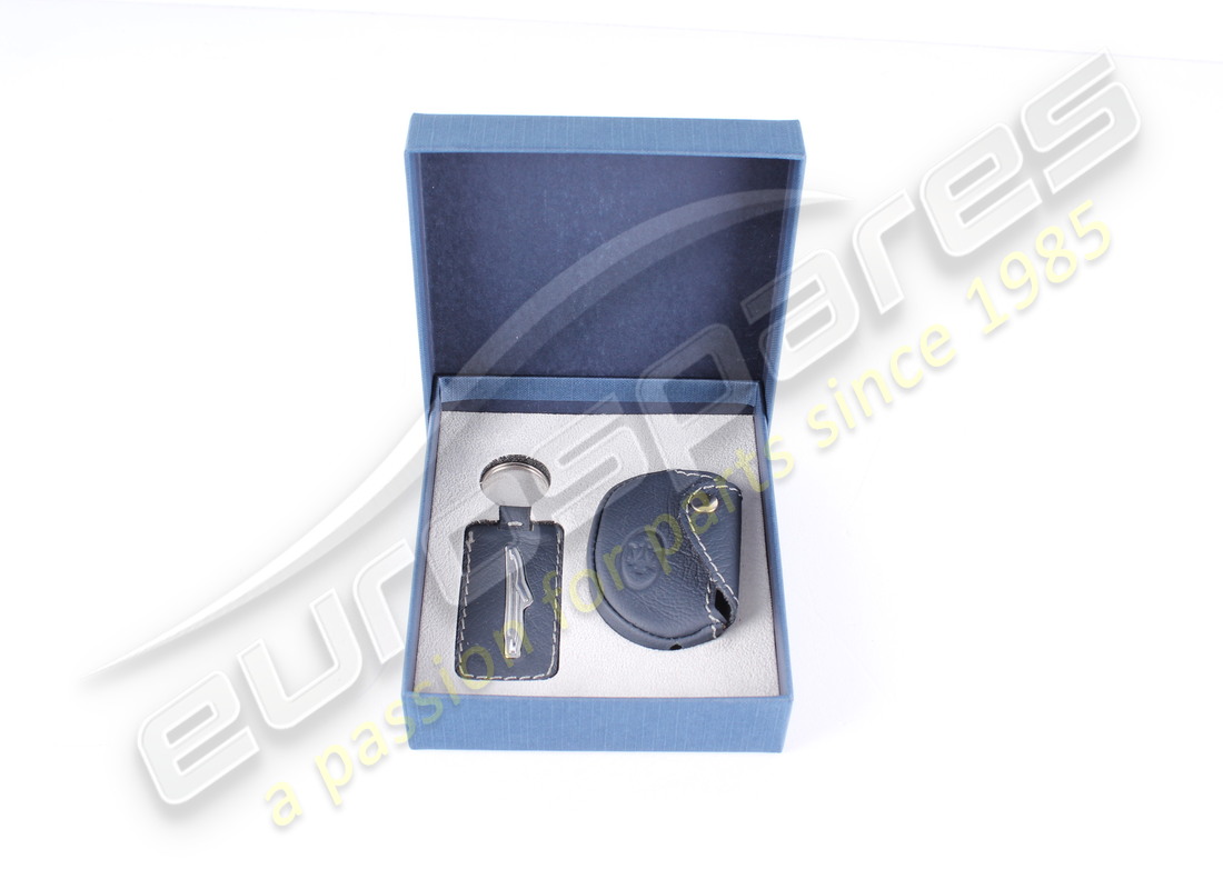 NEW MASERATI LEATHER KEY COVER AND KEYRIN. PART NUMBER 940000418 (2) new maserati leather key cover and keyrin. part number 940000418 (2)